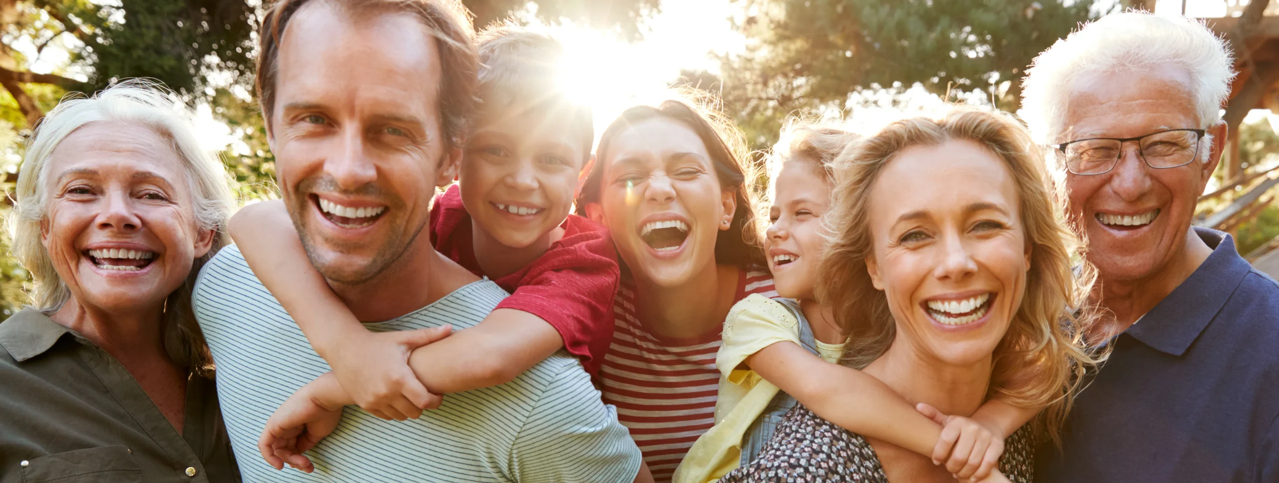 A smiling family together outdoors