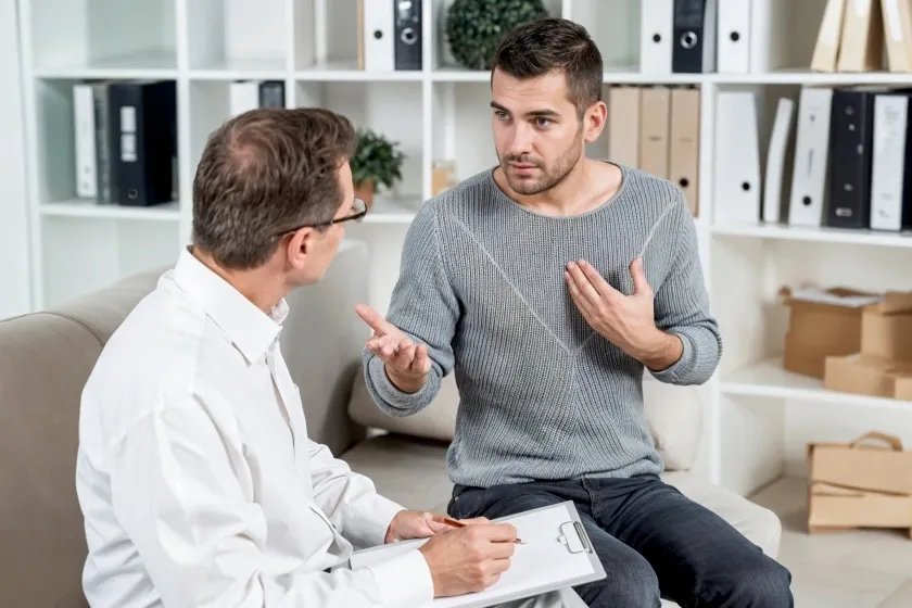 A man talks through a health concern with his physician